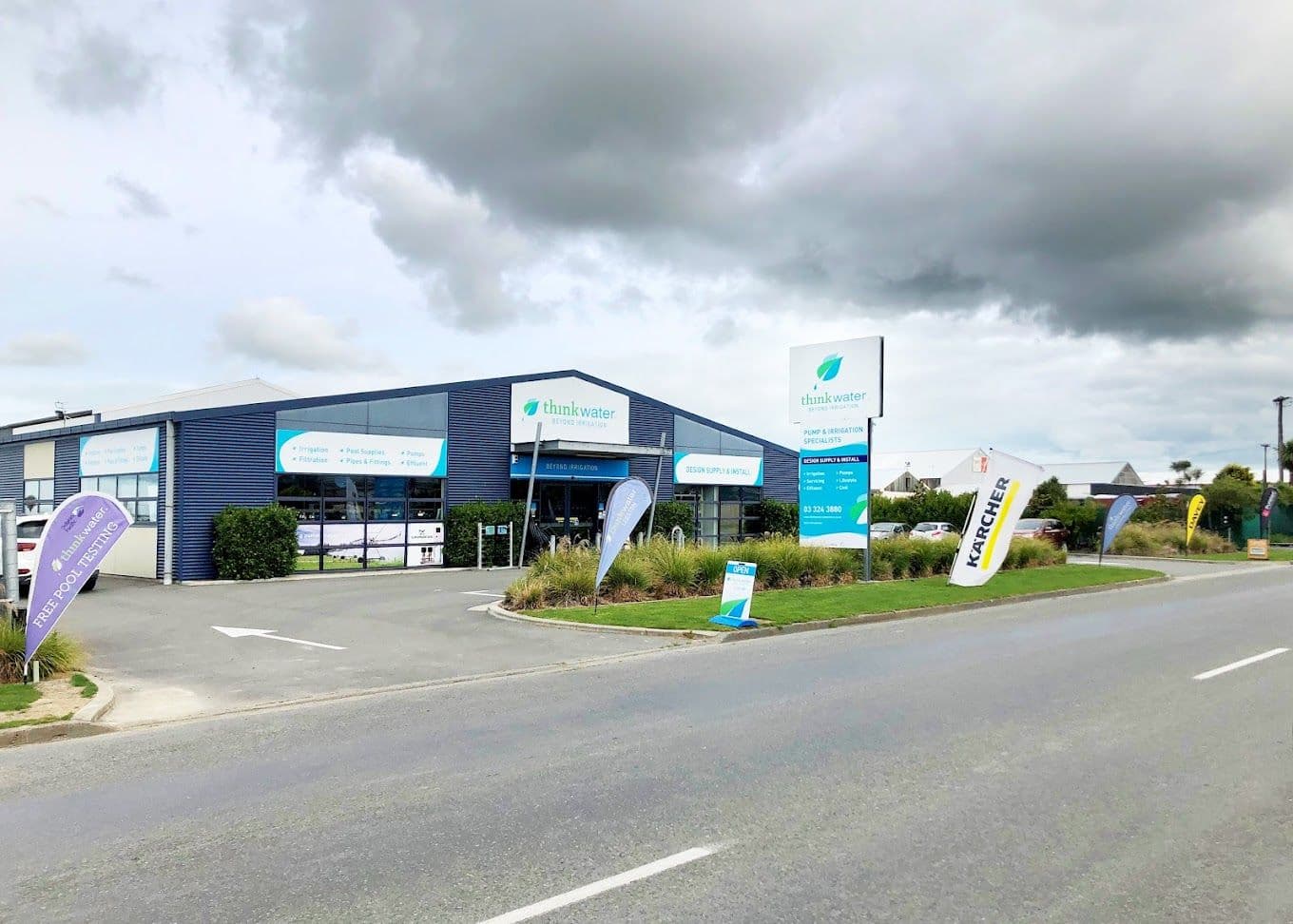 External View of Think Water Store with flags out the front